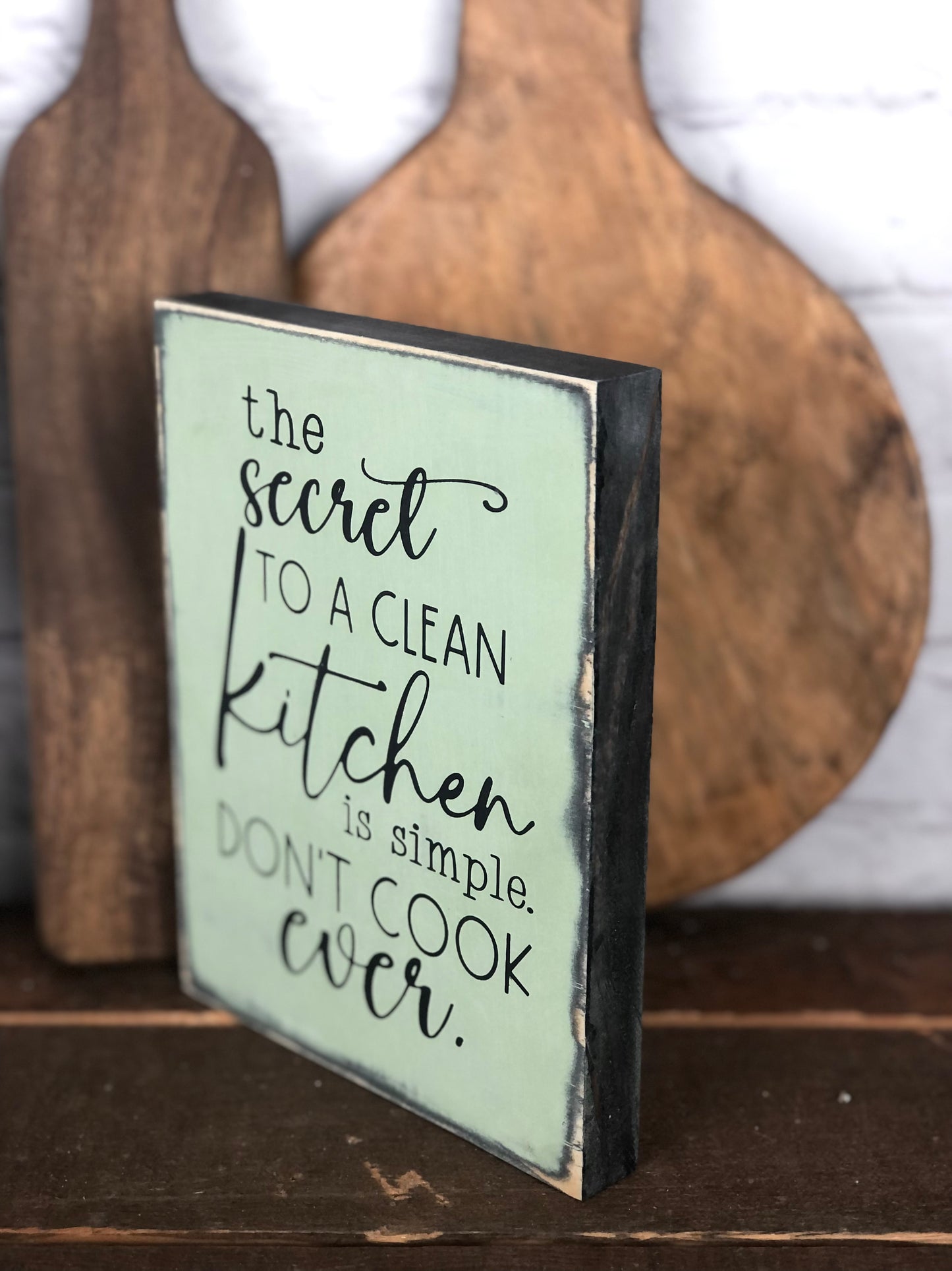 IT IS FINISHED/ THE SECRET TO A CLEAN KITCHEN IS TO NOT COOK EVER- DOUBLE SIDED WOOD SIGN