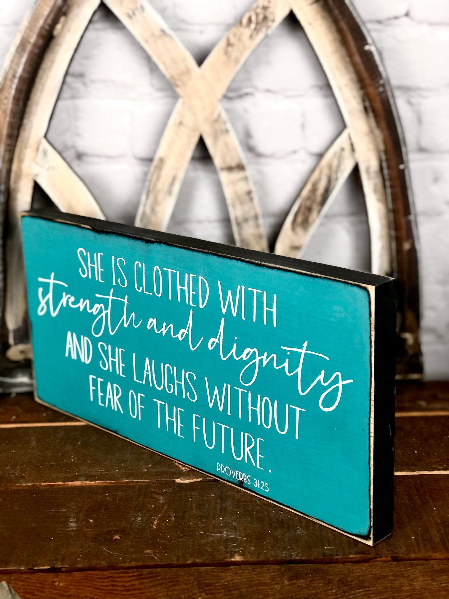 SHE IS CLOTHED WITH STRENGTH AND DIGNITY AND SHE LAUGHS WITHOUT FEAR OF THE FUTURE - WOOD SIGN