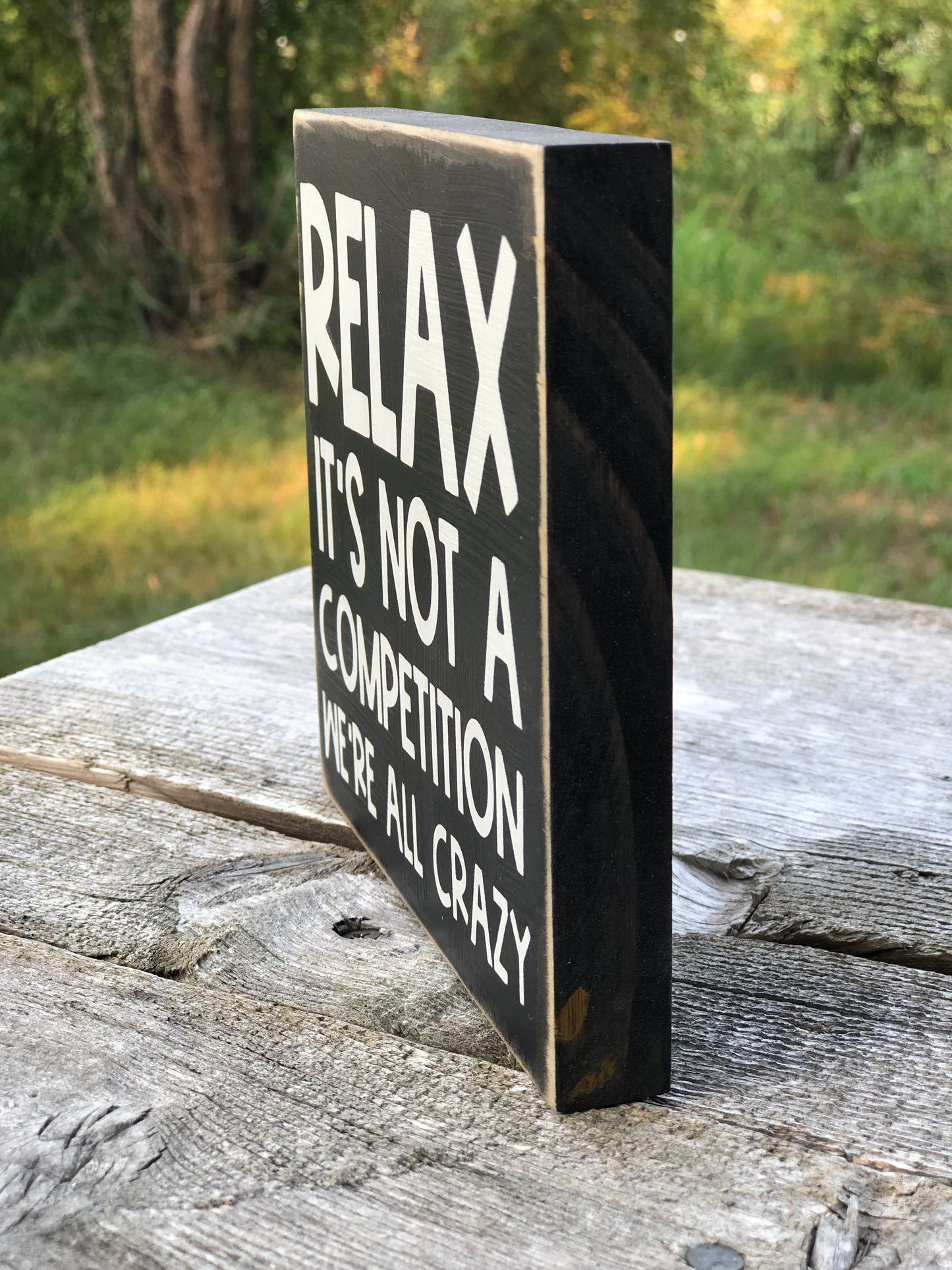 RELAX IT’S NOT A COMPETITION -WE’RE ALL CRAZY -WOOD SIGN