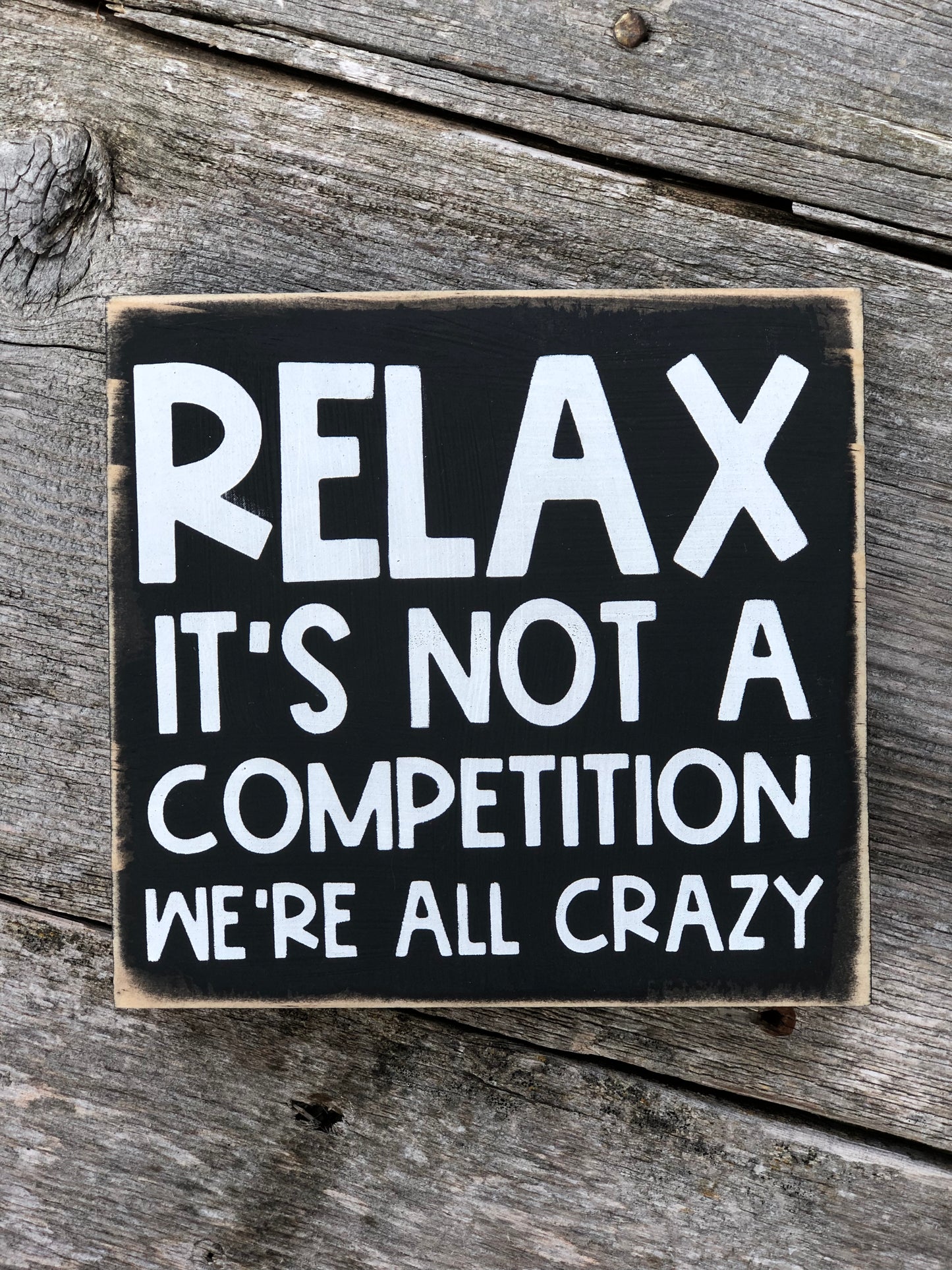 RELAX IT’S NOT A COMPETITION -WE’RE ALL CRAZY -WOOD SIGN