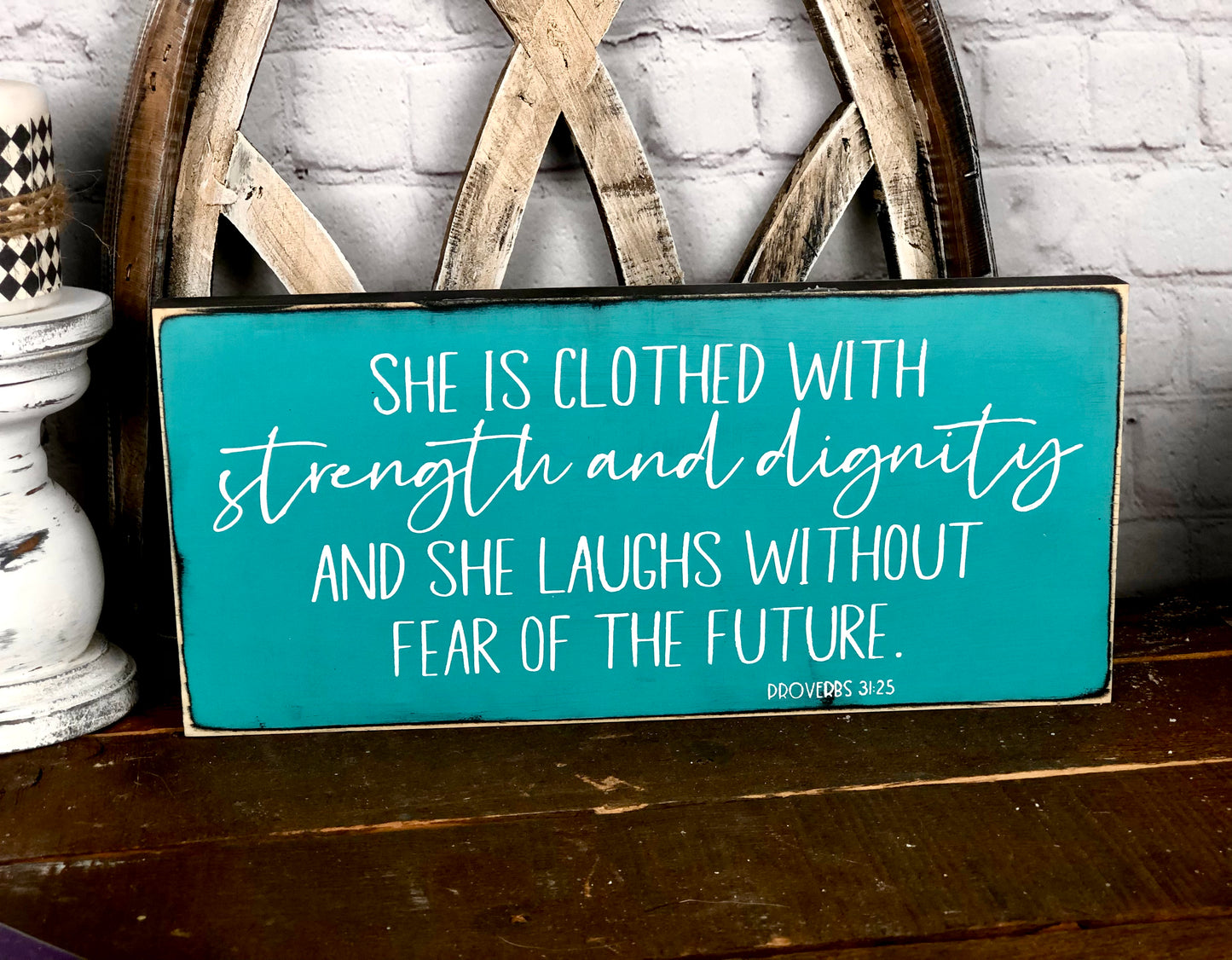 SHE IS CLOTHED WITH STRENGTH AND DIGNITY AND SHE LAUGHS WITHOUT FEAR OF THE FUTURE - WOOD SIGN