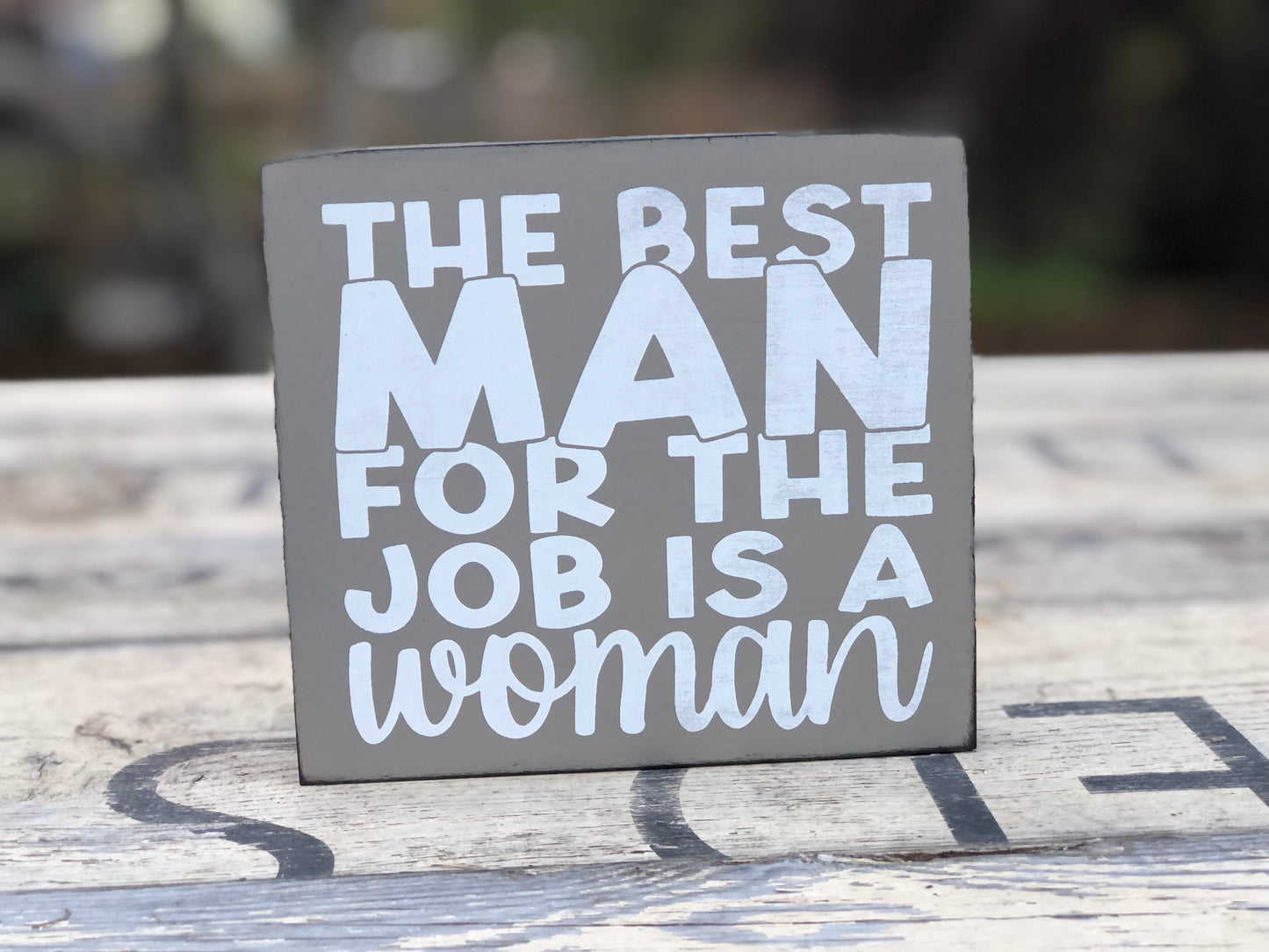 THE BEST MAN FOR THE JOB IS A WOMAN -WE’RE ALL CRAZY -WOOD SIGN