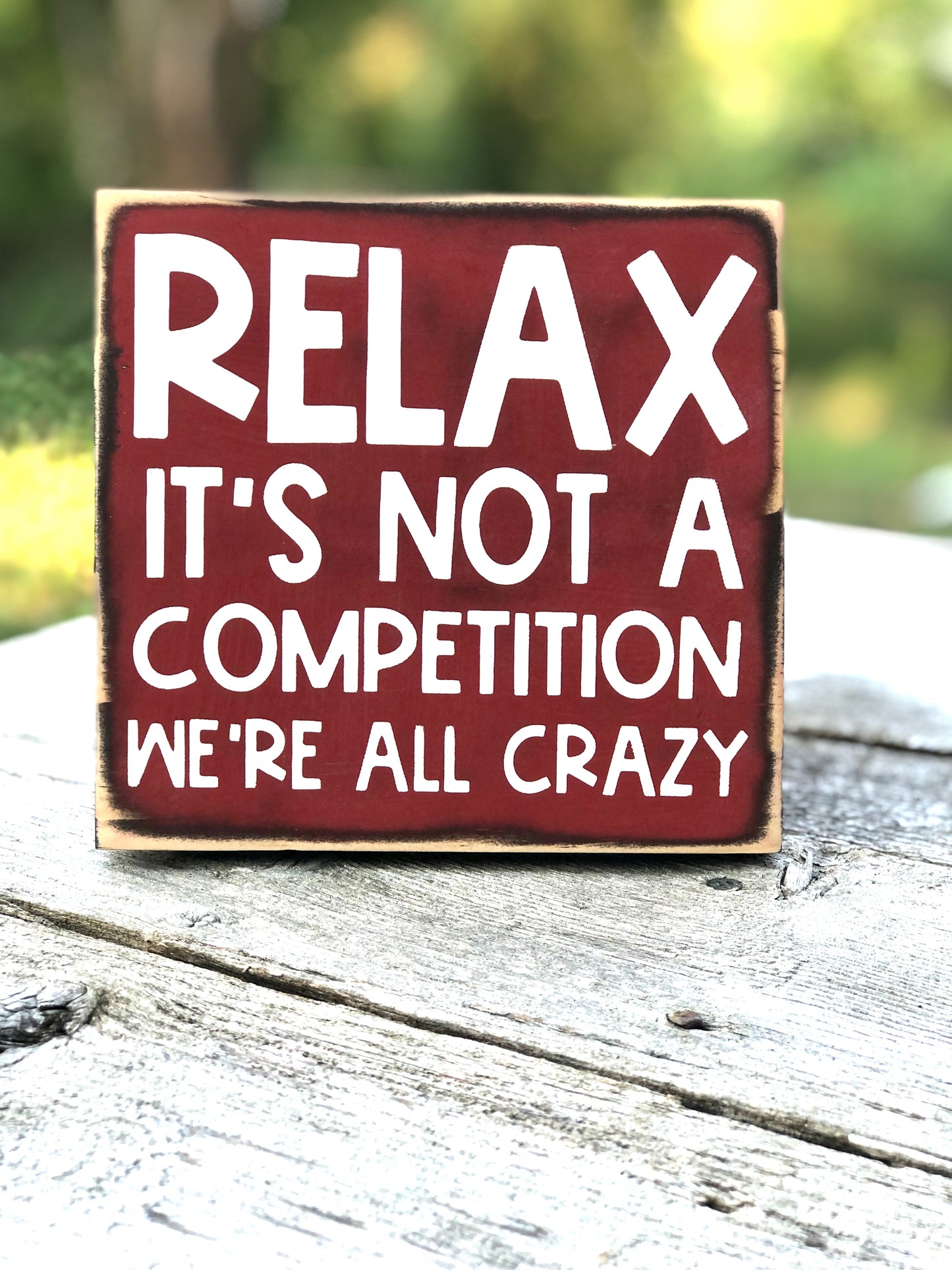 RELAX IT’S NOT A COMPETITION -WE’RE ALL CRAZY -WOOD SIGN